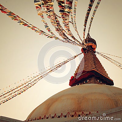 Buddhist shrine Boudhanath Stupa - vintage filter. Stupa with Buddha wisdom eyes. Stock Photo