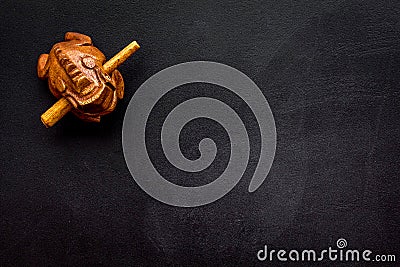Buddhist symbol. Oriental wooden frog on black background top view space for text Stock Photo