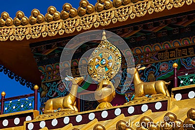 Buddhist Wheel of the Law on monastery, India Stock Photo