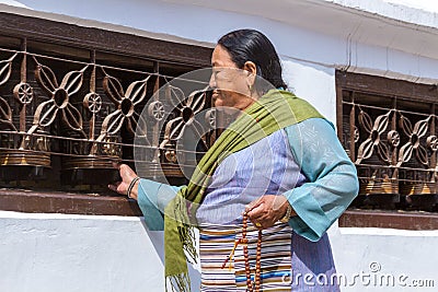 Buddhist Woman Turning Prayer Wheels Editorial Stock Photo