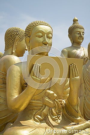 Buddhist's Disciple statue Stock Photo