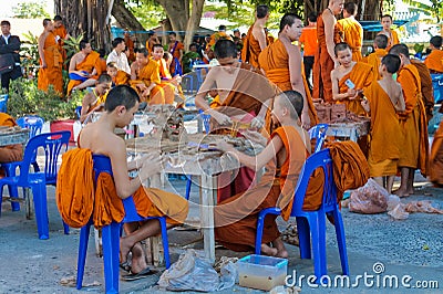 Buddhist young monks doing handcrafts in the temple yard Editorial Stock Photo
