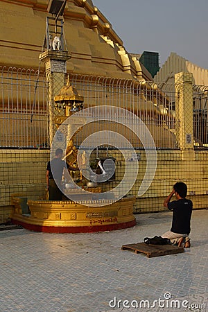 Buddhists pray at the planetary post Editorial Stock Photo