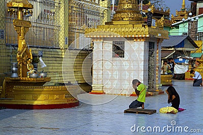 Buddhists pray at the planetary post Editorial Stock Photo