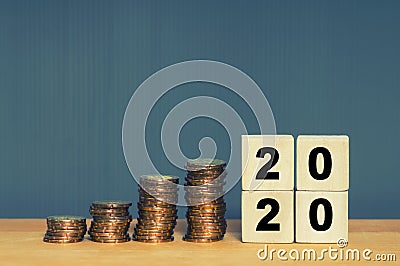 Budget Concept. Budget 2020 written on wooden blocks with a gold coins Stock Photo