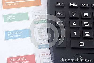 Budget Planner with Black Calculator Stock Photo