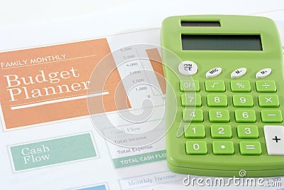 Budget Planner with Green Calculator Stock Photo