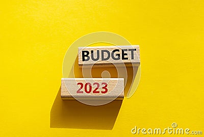 Budget 2023 symbol. Wooden blocks with words Budget 2023. Beautiful yellow background. Business and Budget 2023 concept. Copy Stock Photo