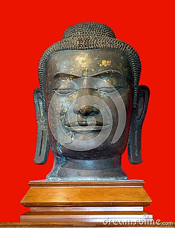 Budha head in red background Stock Photo