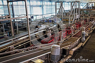 Budvar Budweiser brewery. Bottle sorting, washing and beer bottling workshop with assembly-lines. Editorial Stock Photo