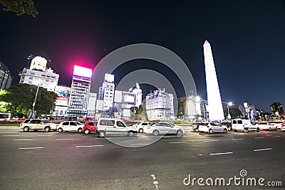 Buenos Aires Argentina Avenida 9 de Julio obelisk at night illuminated with advertising posters Stock Photo