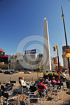Buenos Aires Argentina Corrientes Avenue and subway entrance obelisco with people drinking coffee in a city bar Editorial Stock Photo