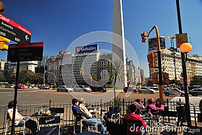 Buenos Aires Argentina Corrientes Avenue and subway entrance obelisco with people drinking coffee in a city bar Editorial Stock Photo