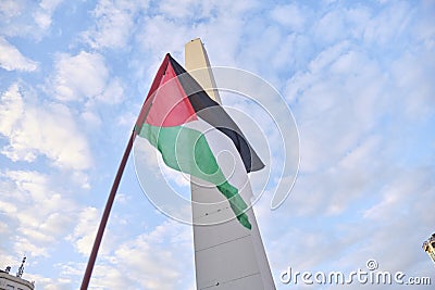 Palestinian flag waving in Buenos Aires, Argentina, in solidarity with Palestine Editorial Stock Photo