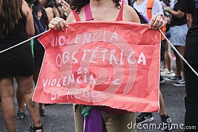 Poster against obstetric violence during the 8M women strike in Argentina Editorial Stock Photo