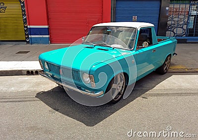 light blue Fiat 128 pickup small utility car 1970s. Expo Warnes 2021 classic car show. Copyspace Editorial Stock Photo