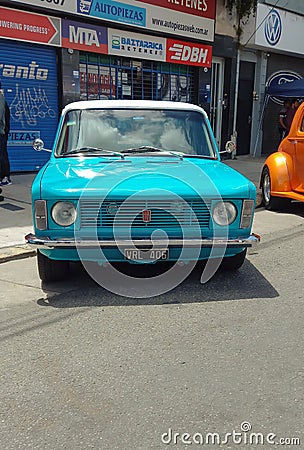 light blue Fiat 128 sedan four door classic small family car 1970s. Expo Warnes 2021. Copyspace Editorial Stock Photo