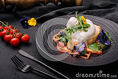 Buffalo burrata cheese served with grain toast pasting and fresh vegetables Stock Photo