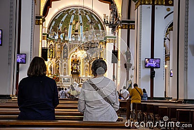 People at the Interior of the Minor Basilica of the Lord of Miracles located in the city of Guadalajara de Buga Editorial Stock Photo