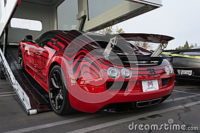 Bugatti Veyron entering enclosed auto transport Editorial Stock Photo