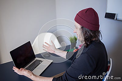 Bugs and errors in the development. A young programmer in the workplace has problems at work Stock Photo