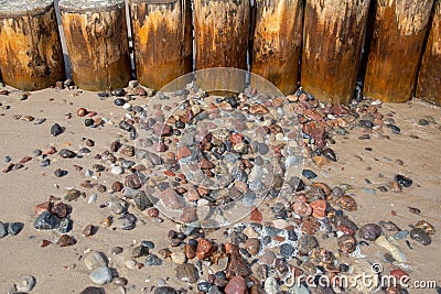 Buhnen with washed stones on the beach of the Baltic Sea in the seaside resort Zempin on Usedom Stock Photo