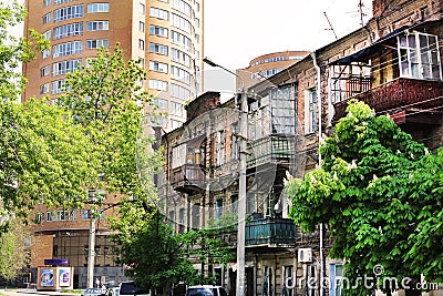 A build eclecticism in town is an old and new house in one street Editorial Stock Photo