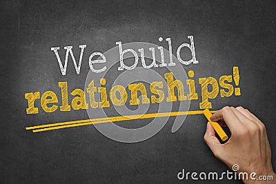 We build relationships - hand writing business concept on chalkboard Stock Photo