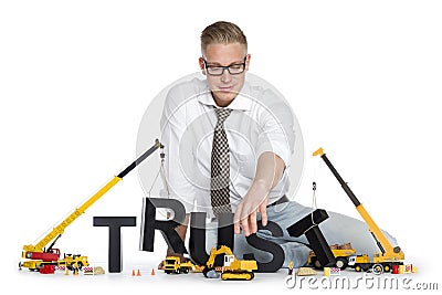 Build up trust: Businessman building trust-word. Stock Photo