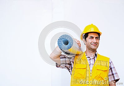 Builder is carrying insulation rolls on white background Stock Photo