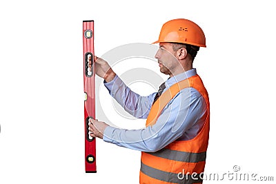 Builder Holding Building Level Working Standing Over White Background, Side-View Stock Photo