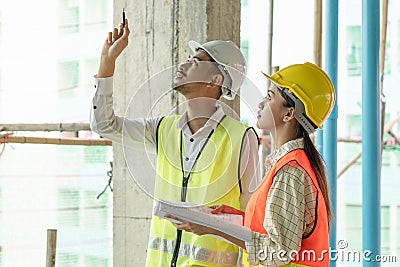 Builder inspection consultancy. Two engineer consulting and checking material and structure in construction Stock Photo