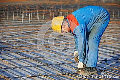 Builder making reinforcement for concrete Stock Photo