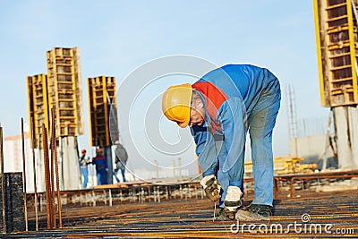 Builder making reinforcement for concrete Stock Photo
