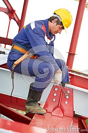 Builder millwright worker at construction site Stock Photo