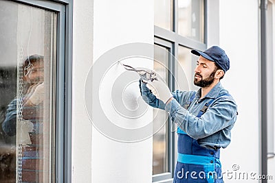 Builder mounting wiring for outdoor lighting Stock Photo
