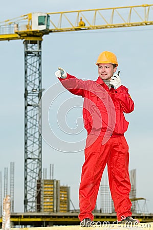 Builder operating the tower crane Stock Photo