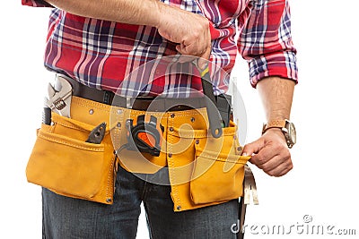 Builder placing wrench in pocket close-up Stock Photo