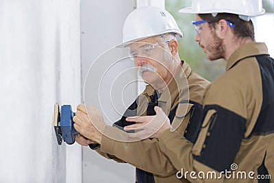 builder polishing the wall Stock Photo