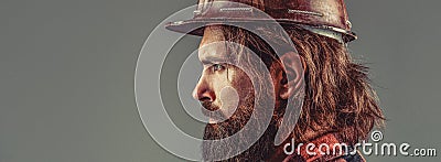 Builder in protective clothing and helmet. Male builder. Portrait bearded man with protec helmet wearing. Man builders Stock Photo