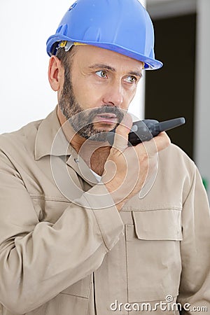 Builder talking in walkie-talkie Stock Photo