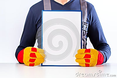 Builder with white board. Stock Photo