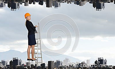 Builder woman ladder . Mixed media Stock Photo