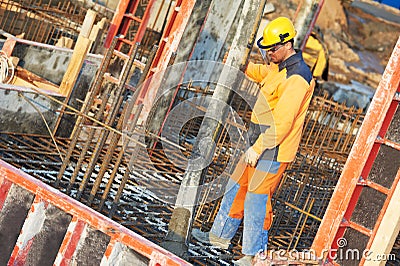 Builder worker at concrete work Stock Photo