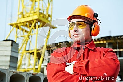 Builder worker at construction site Stock Photo
