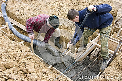 Builders making foundations Stock Photo