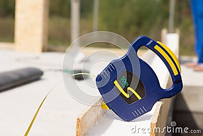 Builders retractable tape measure on site Stock Photo