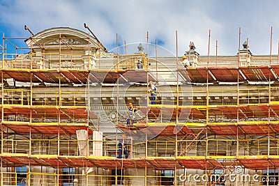 Builders on scaffolding for restoration ancient Editorial Stock Photo