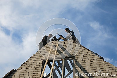 Builders steeplejacks Stock Photo