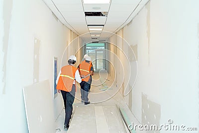 Group of builders and architects supervising the progress of the work. Editorial Stock Photo
